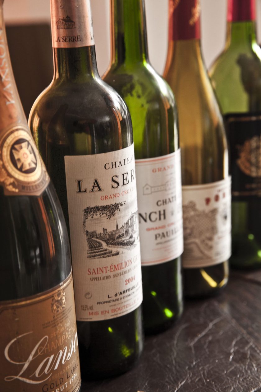 Bottles of red wine standing together